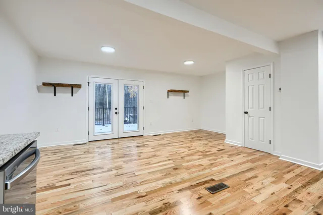 a view of an empty room and window