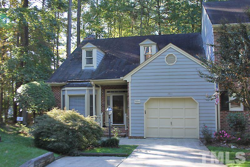 7811 Coach House Lane Raleigh, NC 27615 - Photo 1 of 19 a front view of a house with a garage