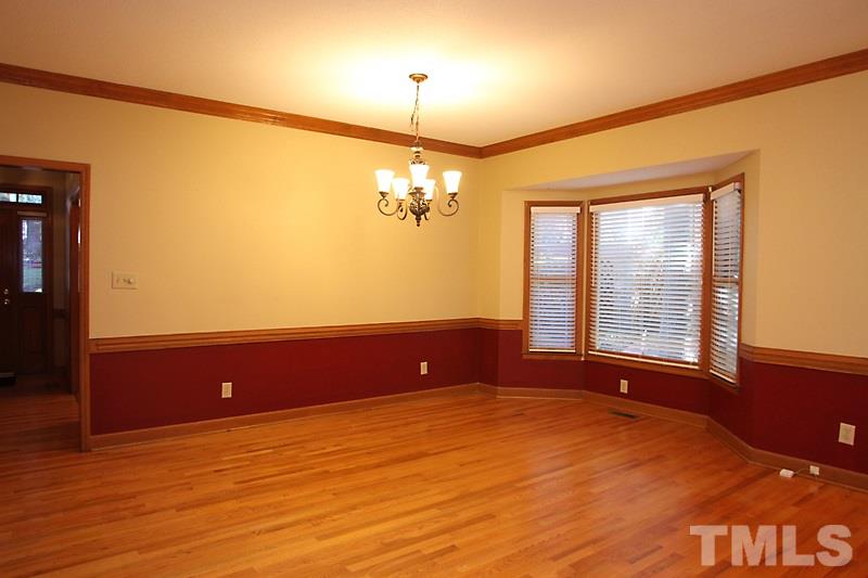 7811 Coach House Lane Raleigh, NC 27615 - Photo 4 of 19 a view of an empty room with a window