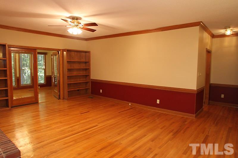 7811 Coach House Lane Raleigh, NC 27615 - Photo 6 of 19 a view of room with furniture and wooden floor