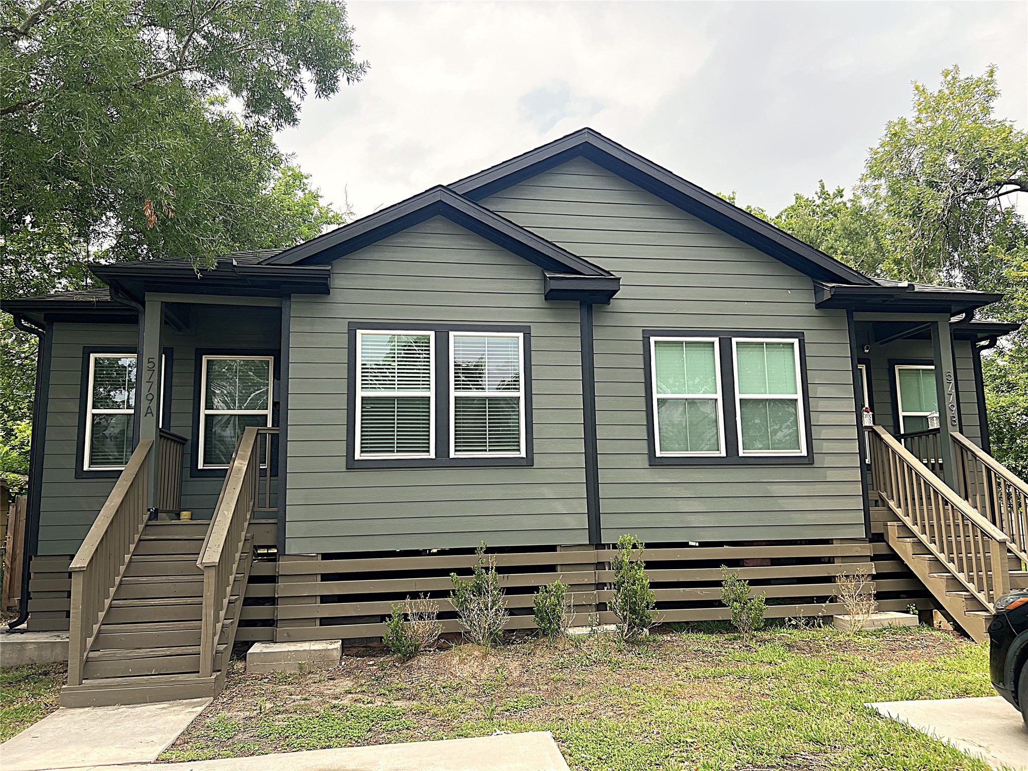5779 Belarbor Street, Unit A Houston, TX 77033 - Photo 1 of 27 a front view of a house with stairs