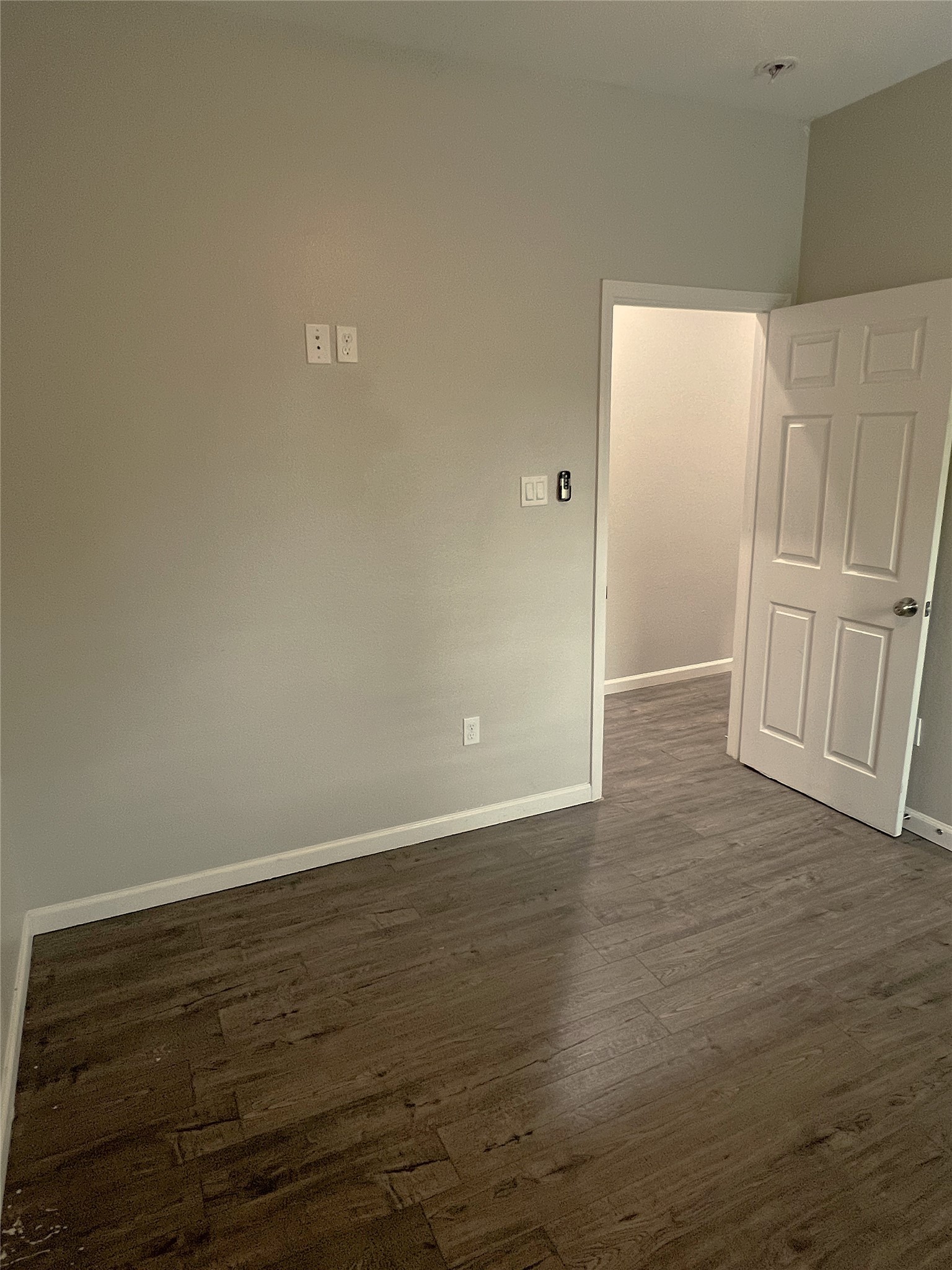 5779 Belarbor Street, Unit A Houston, TX 77033 - Photo 18 of 27 a view of an empty room with wooden floor