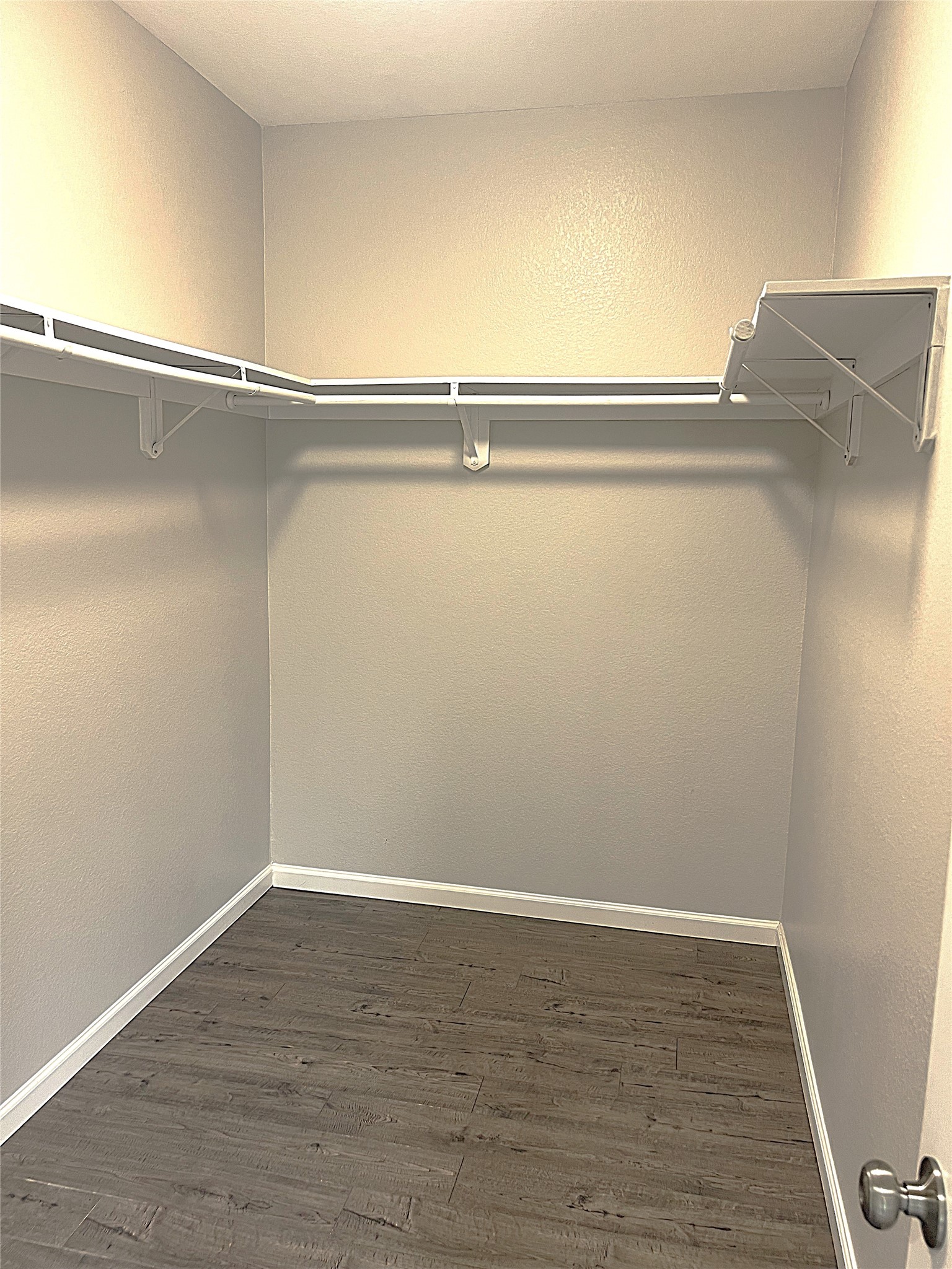 5779 Belarbor Street, Unit A Houston, TX 77033 - Photo 21 of 27 a view of a room with wooden floor