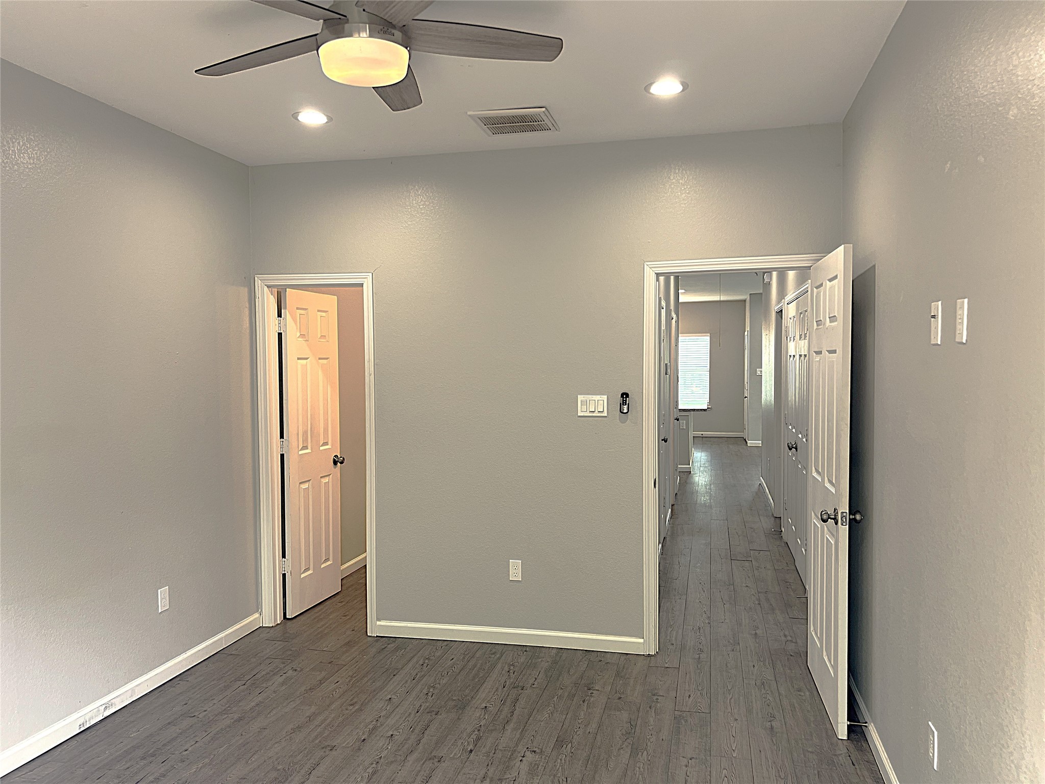 5779 Belarbor Street, Unit A Houston, TX 77033 - Photo 22 of 27 wooden floor in an empty room