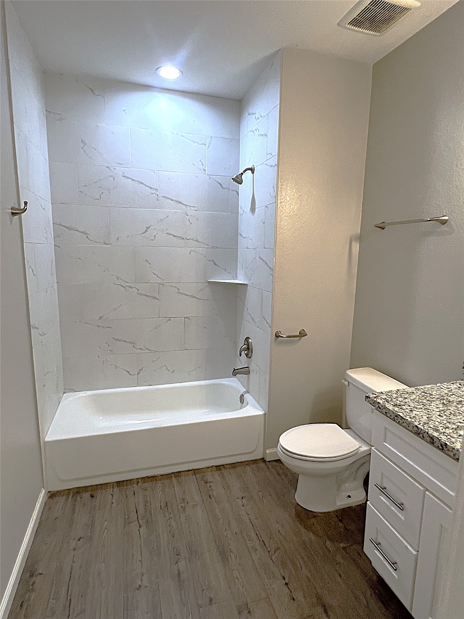 5779 Belarbor Street, Unit A Houston, TX 77033 - Photo 23 of 27 a bathroom with a sink a toilet and a bathtub