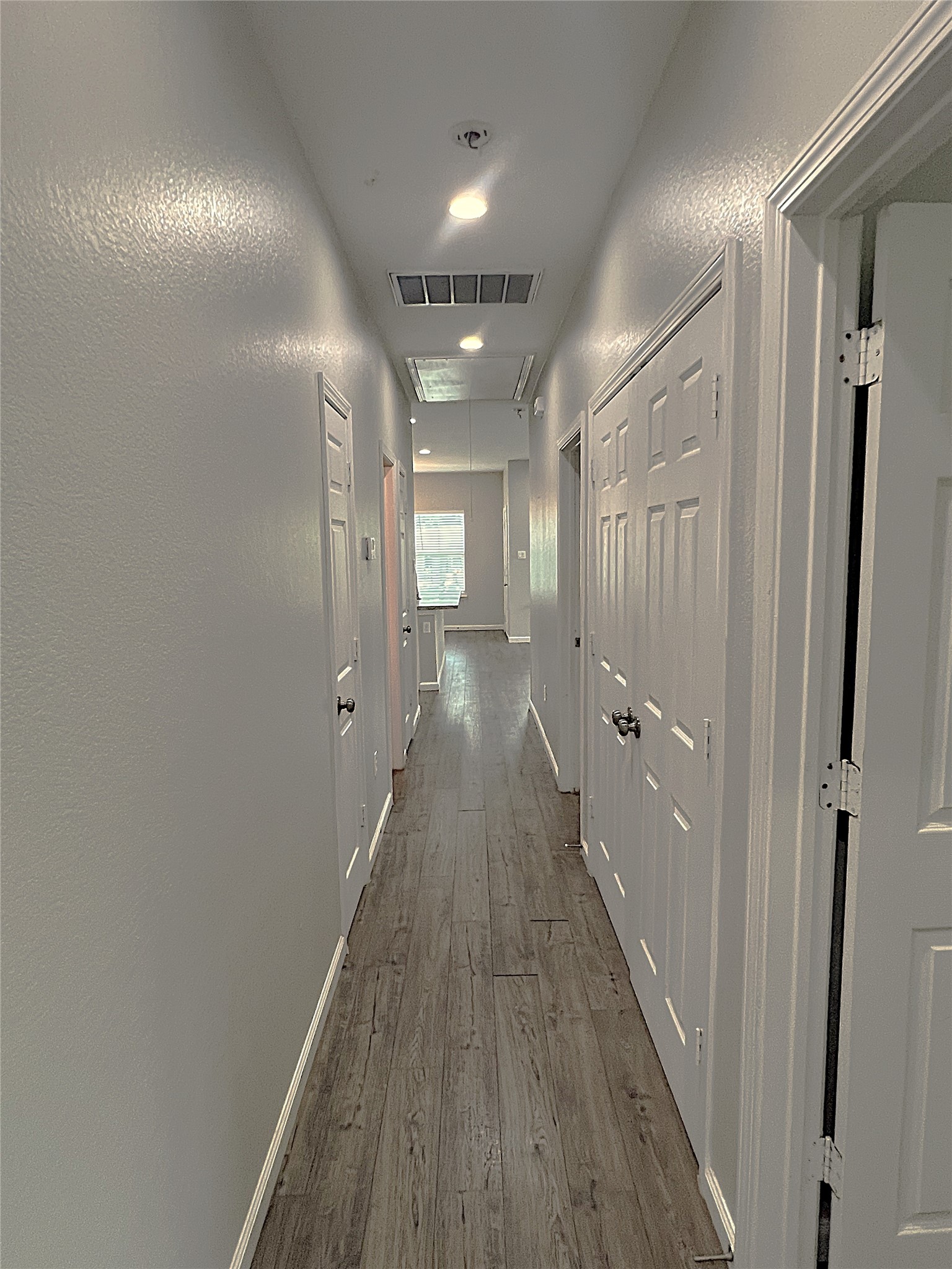 5779 Belarbor Street, Unit A Houston, TX 77033 - Photo 25 of 27 a view of a hallway with wooden floor