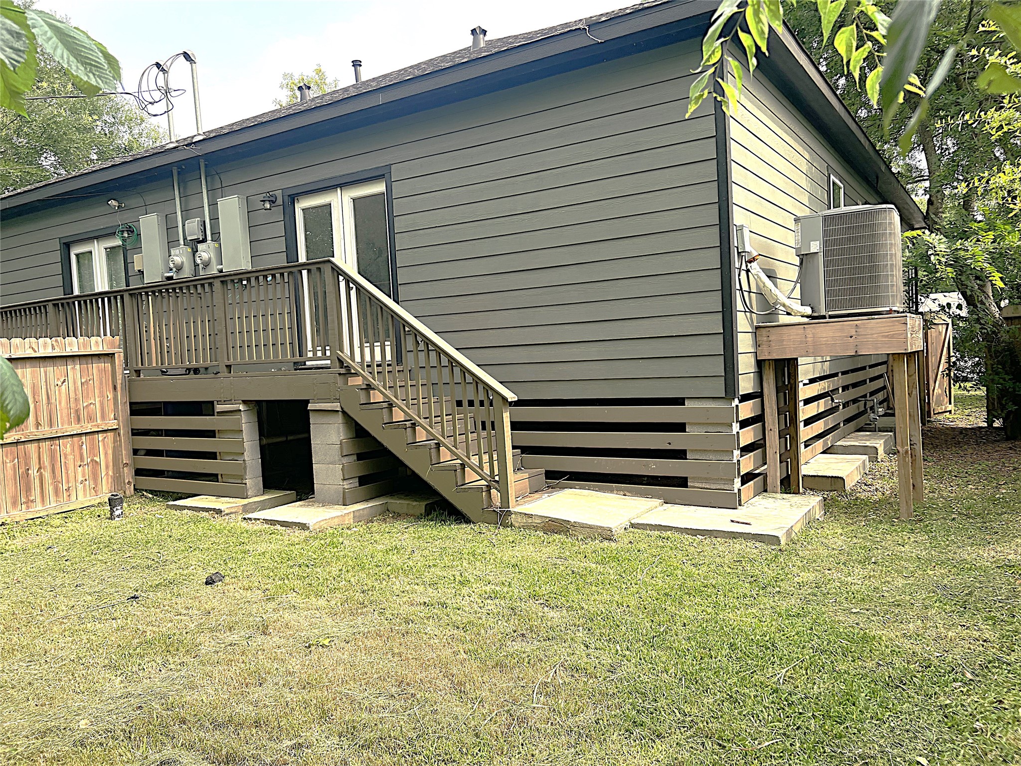 5779 Belarbor Street, Unit A Houston, TX 77033 - Photo 27 of 27 a view of a house with wooden fence