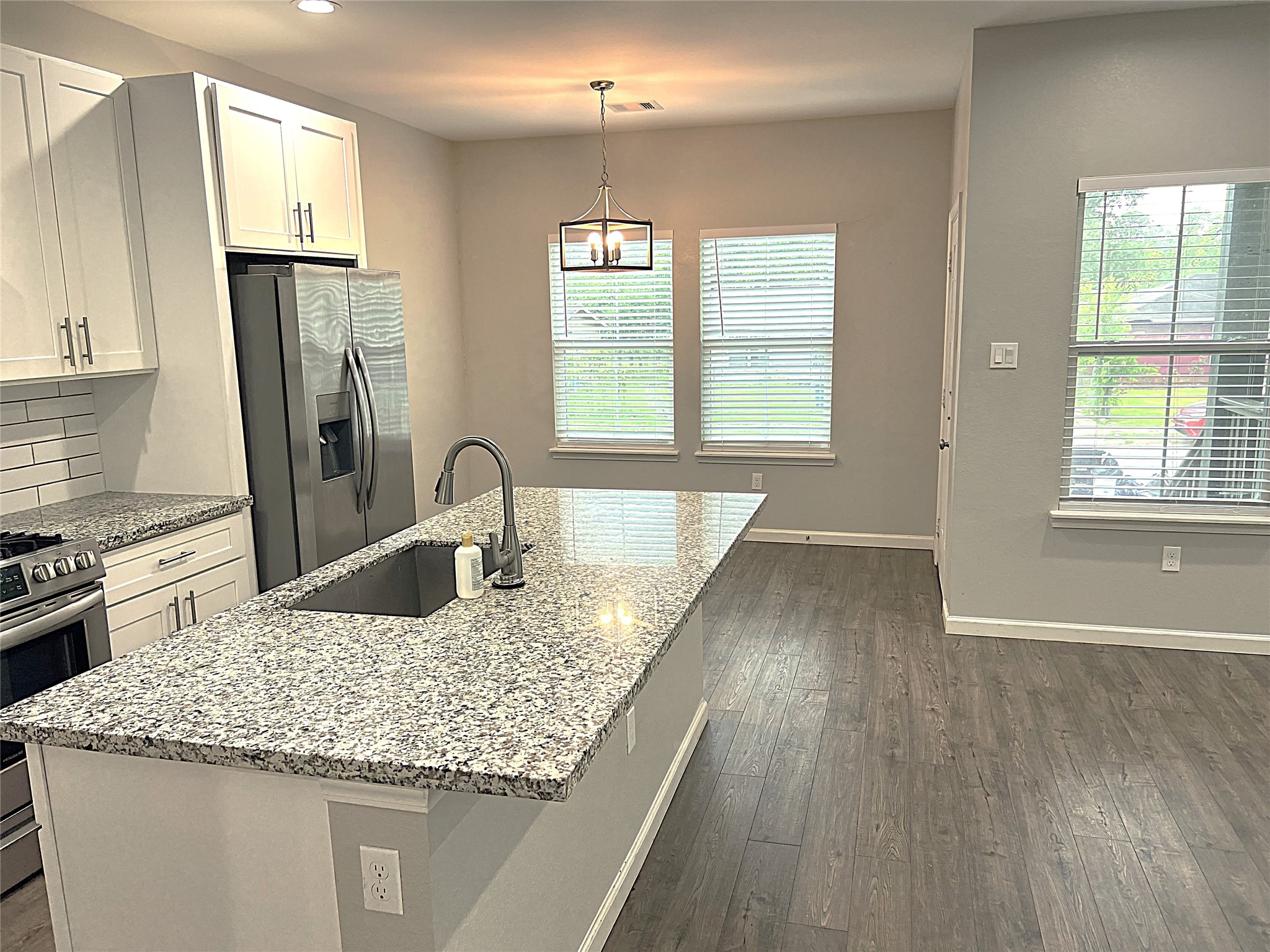 5779 Belarbor Street, Unit A Houston, TX 77033 - Photo 6 of 27 a kitchen with sink and window