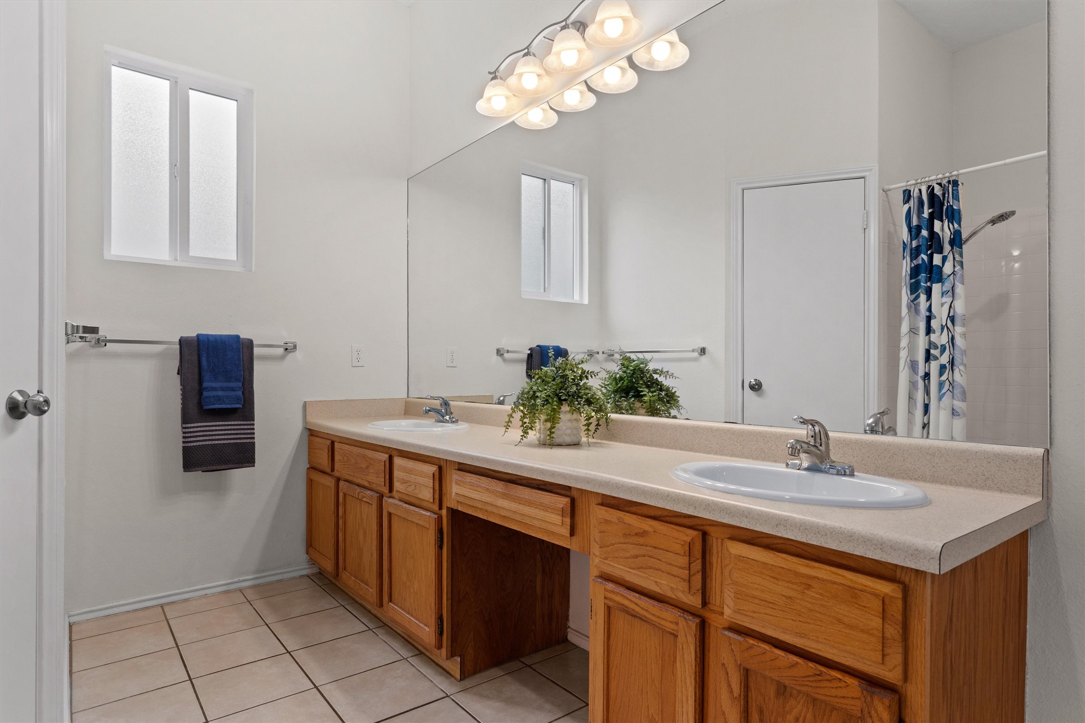 14818 Yellowleaf Trail Austin, TX 78728 - Photo 15 of 40 a bathroom with a sink a light fixture and a mirror