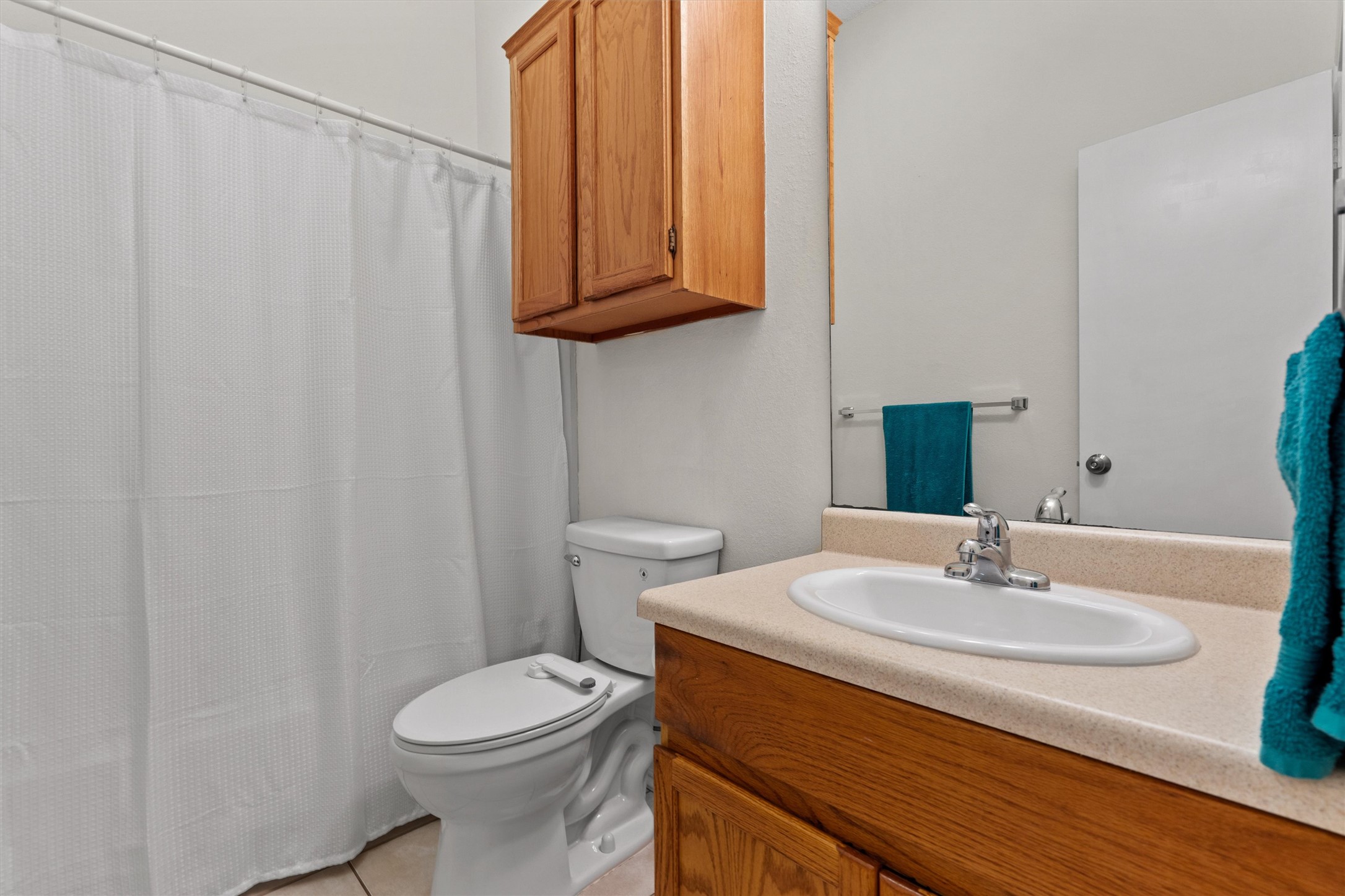 14818 Yellowleaf Trail Austin, TX 78728 - Photo 18 of 40 a bathroom with a sink a toilet and mirror