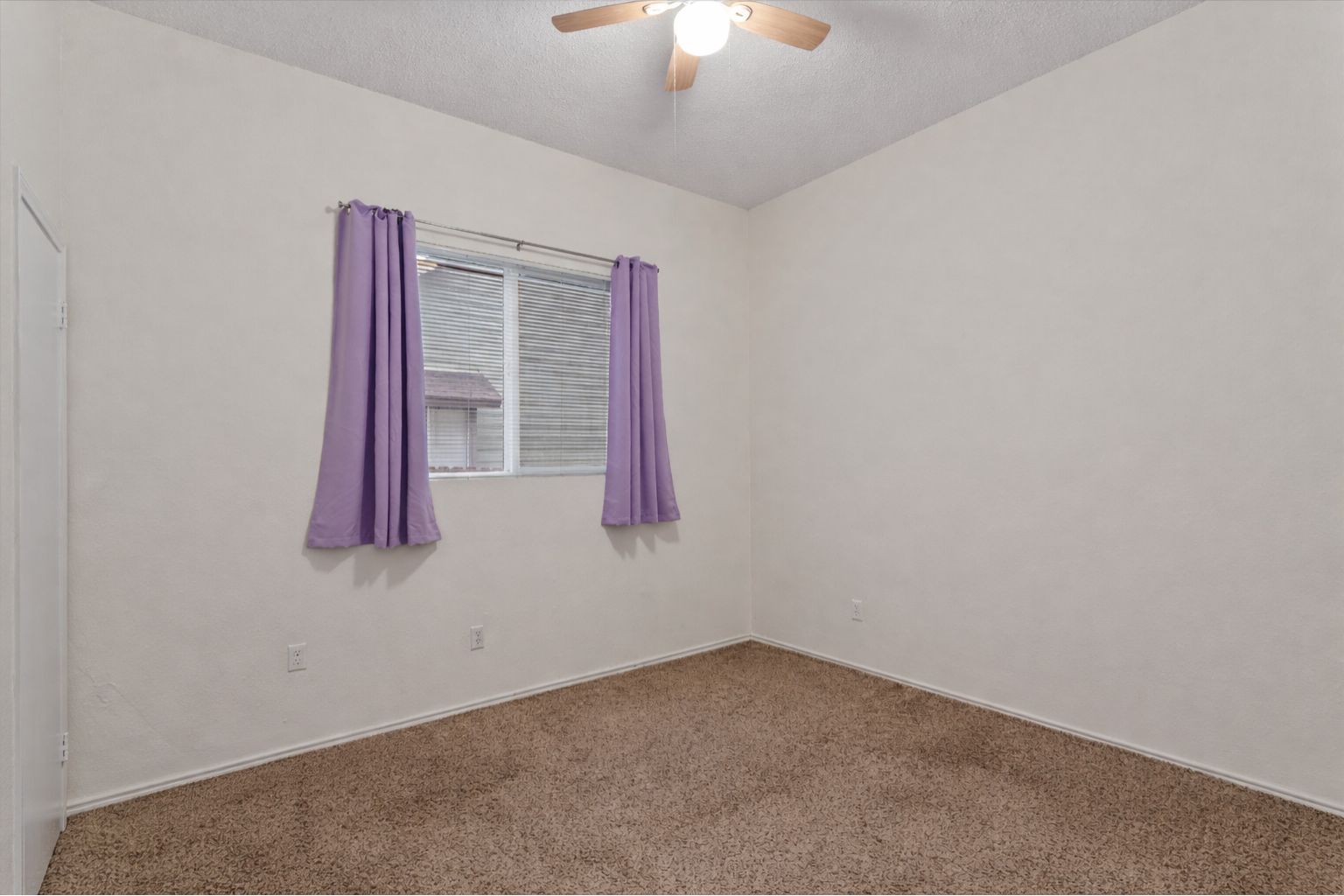 14818 Yellowleaf Trail Austin, TX 78728 - Photo 20 of 40 an empty room with a window and a ceiling fan