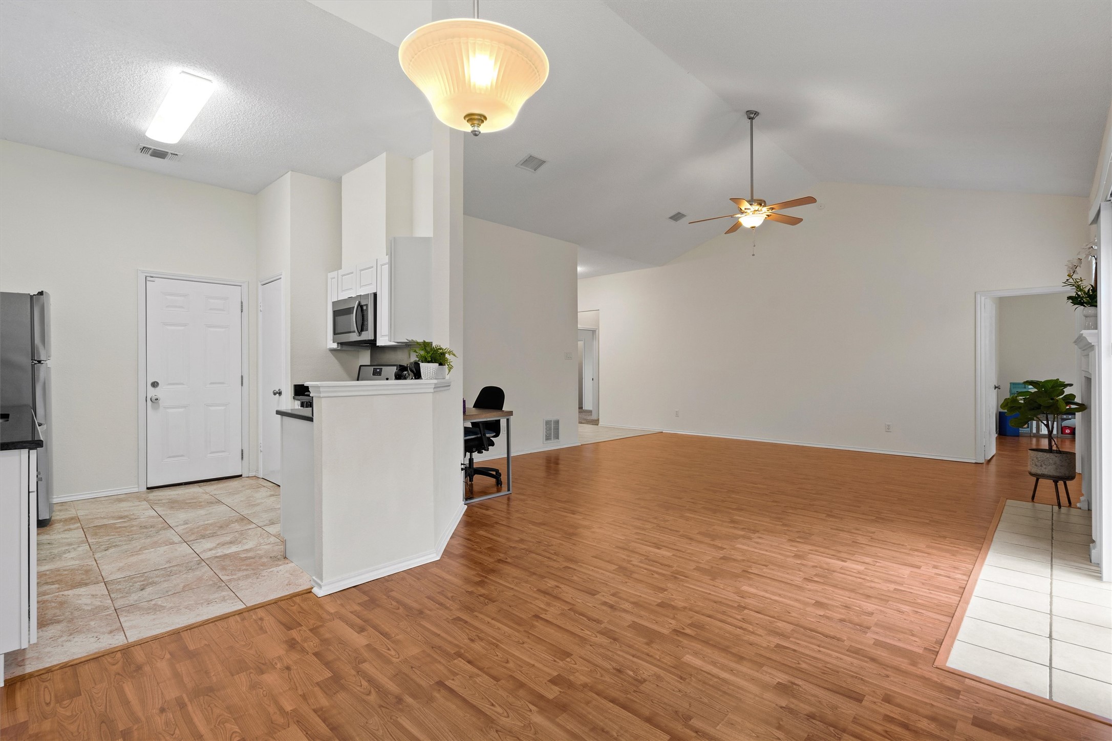 14818 Yellowleaf Trail Austin, TX 78728 - Photo 10 of 40 a view of a kitchen with furniture and wooden floor