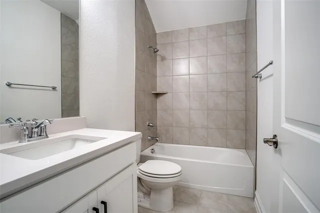 a bathroom with a sink a toilet and a bathtub