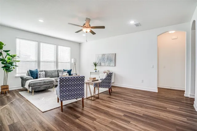a living room with furniture and a large window