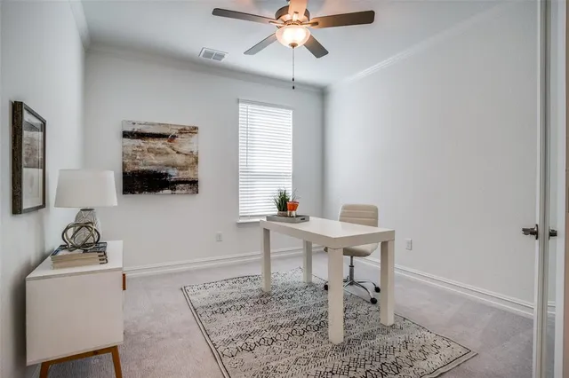 a workspace with furniture and window