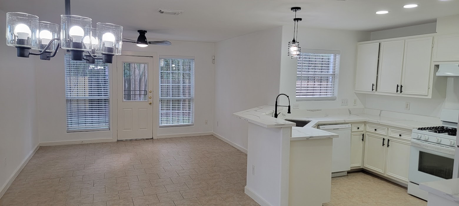 3116 Bolt Street Houston, TX 77051 - Photo 13 of 14 a kitchen that has a sink cabinets and window