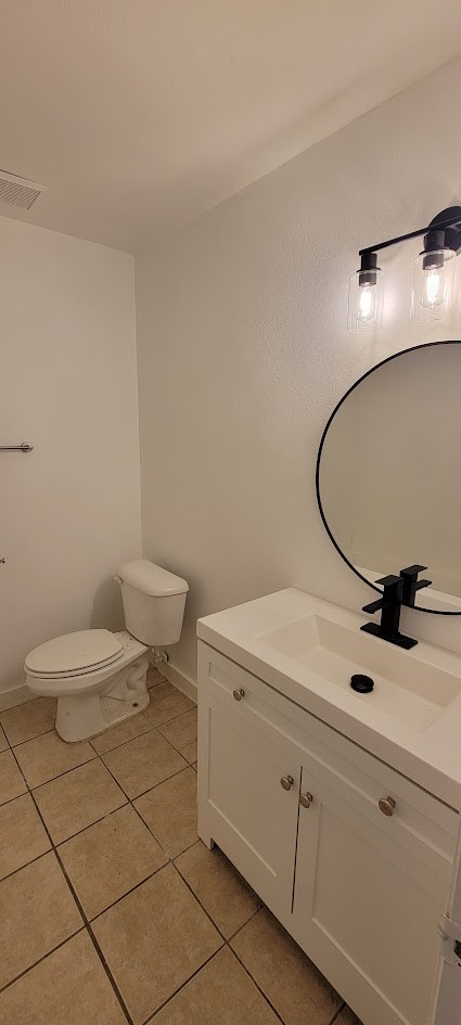 3116 Bolt Street Houston, TX 77051 - Photo 5 of 14 a bathroom with a toilet a sink and mirror