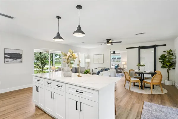a view of room with wooden floor
