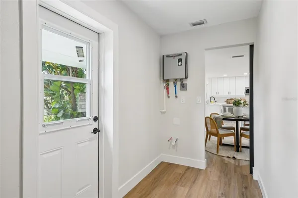a bedroom with a bed window and a potted plant