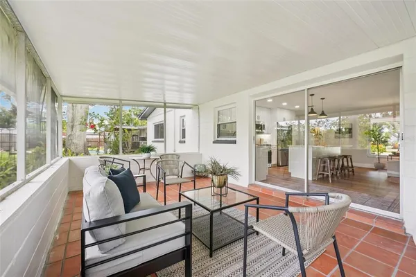 a view of a entrance gate of the house and trees