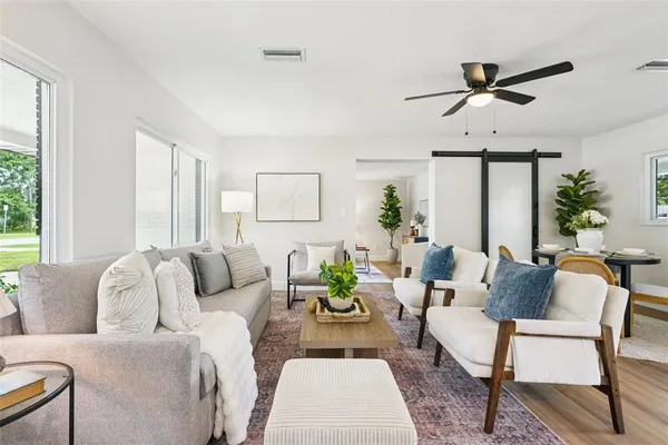 a living room with furniture and a large window
