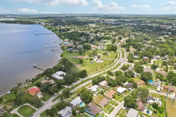 an aerial view of residential houses with outdoor space