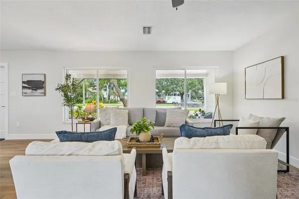 a living room with furniture and a large window