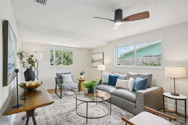 a living room with furniture and a table