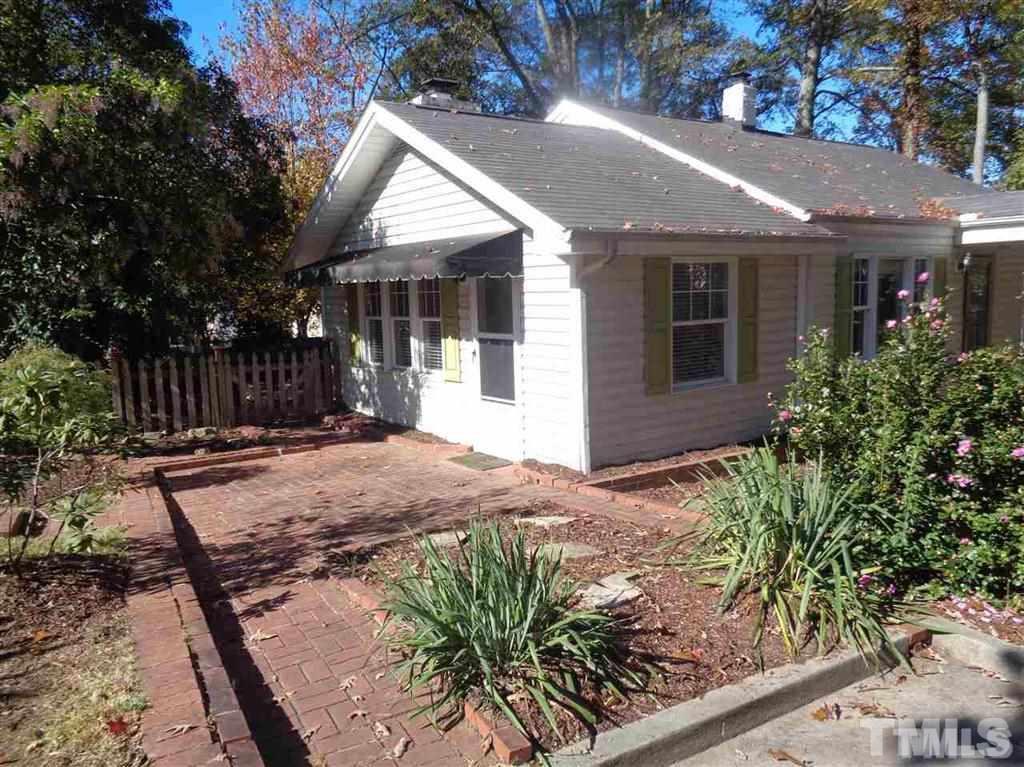 2901 Oberlin Road Raleigh, NC 27608 - Photo 2 of 18 a front view of house with yard and trees around