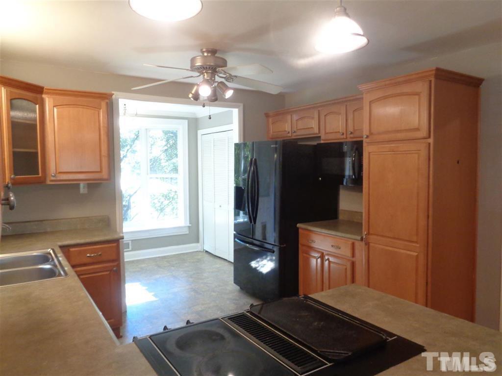 2901 Oberlin Road Raleigh, NC 27608 - Photo 4 of 18 a kitchen with stainless steel appliances granite countertop a refrigerator and a sink