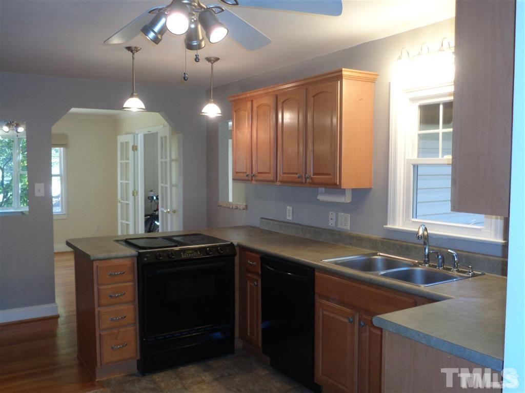 2901 Oberlin Road Raleigh, NC 27608 - Photo 18 of 18 a kitchen that has a sink and cabinets