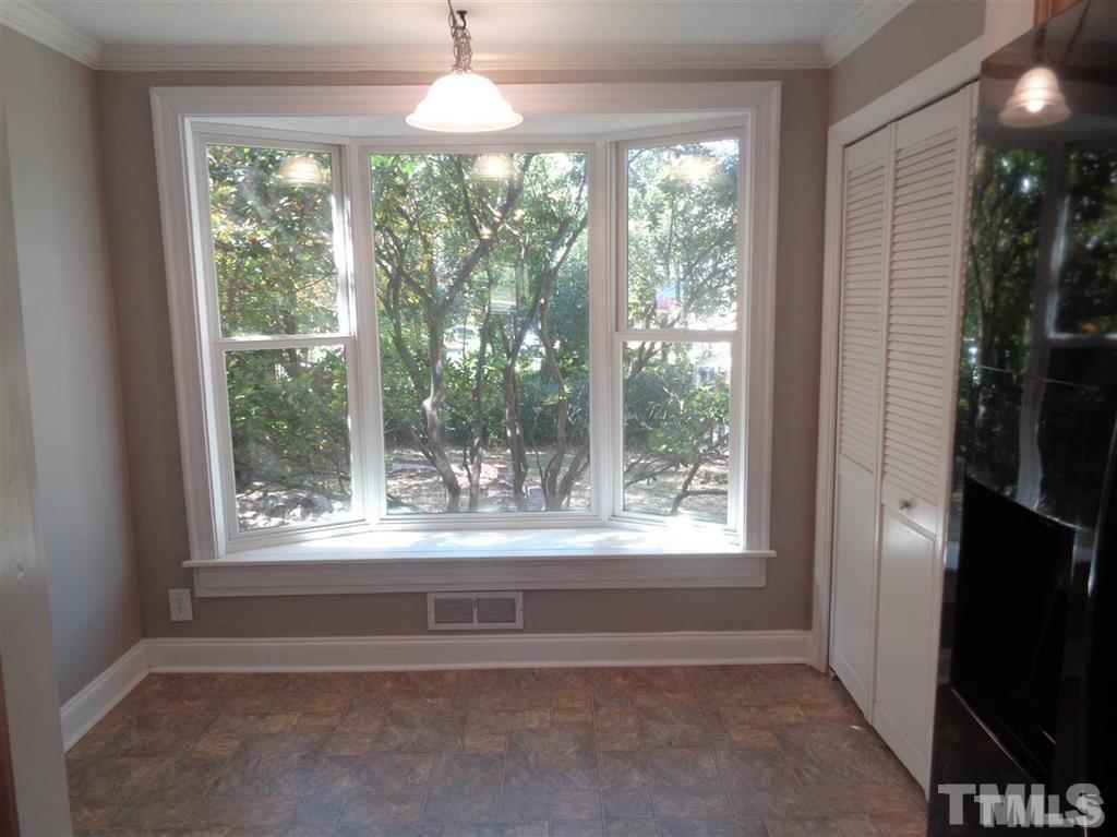 2901 Oberlin Road Raleigh, NC 27608 - Photo 5 of 18 a view of a room with a large window and front door