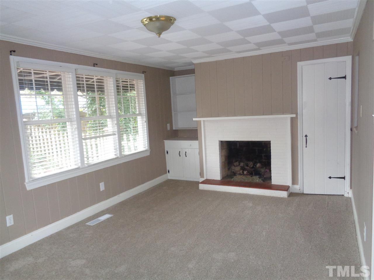 2901 Oberlin Road Raleigh, NC 27608 - Photo 6 of 18 a view of an empty room with a window