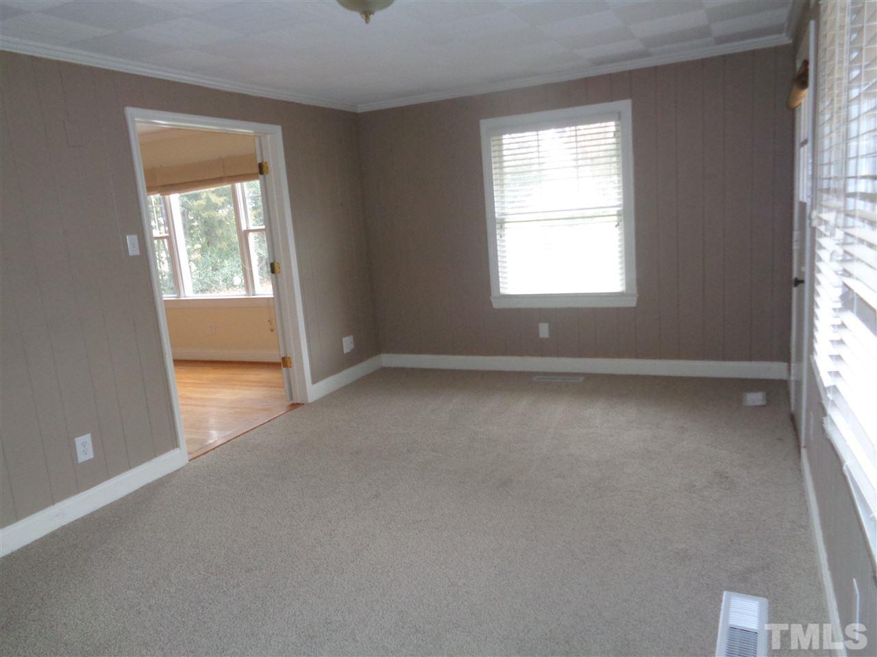 2901 Oberlin Road Raleigh, NC 27608 - Photo 7 of 18 an empty room with a window