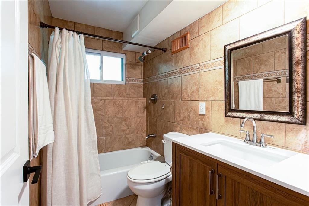 2814 Goodfellows Road Tucker, GA 30084 - Photo 30 of 46 a bathroom with a granite countertop sink toilet and shower