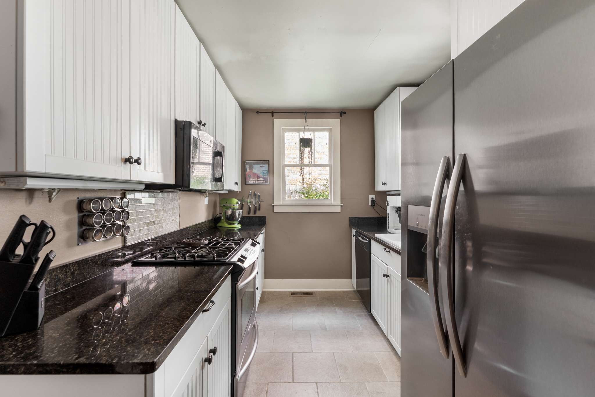 3905 Nevada Avenue Nashville, TN 37209 - Photo 13 of 39 a kitchen with a refrigerator and a sink