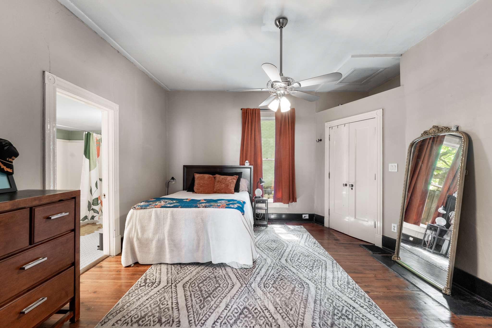 3905 Nevada Avenue Nashville, TN 37209 - Photo 20 of 39 a bedroom with a bed and a chandelier