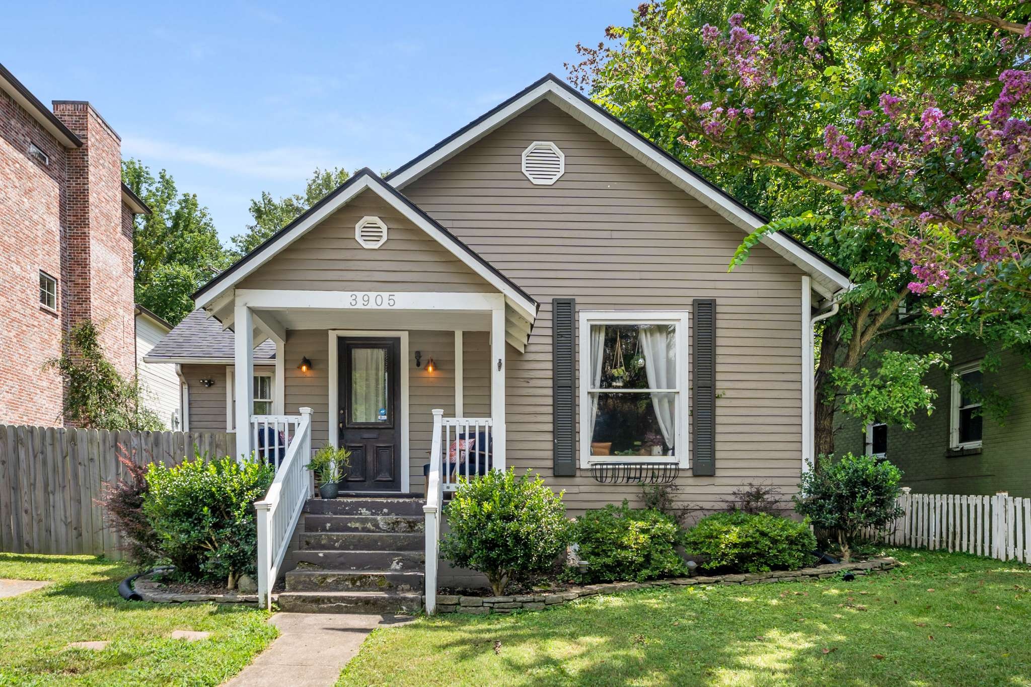 3905 Nevada Avenue Nashville, TN 37209 - Photo 2 of 39 a view of a house with brick walls and a yard with plants