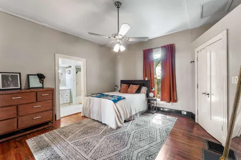 a bed room with a bed and a chandelier