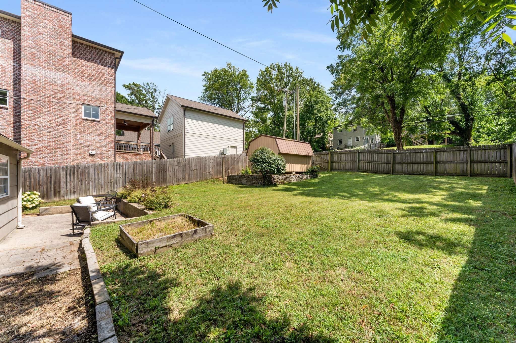 3905 Nevada Avenue Nashville, TN 37209 - Photo 25 of 39 a view of a backyard with table and chairs and a barbeque