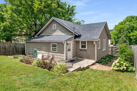 a view of a house with a yard and plants