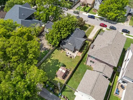 an aerial view of residential house with outdoor space and street view