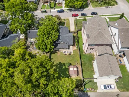 an aerial view of a house with outdoor space pool seating area and yard