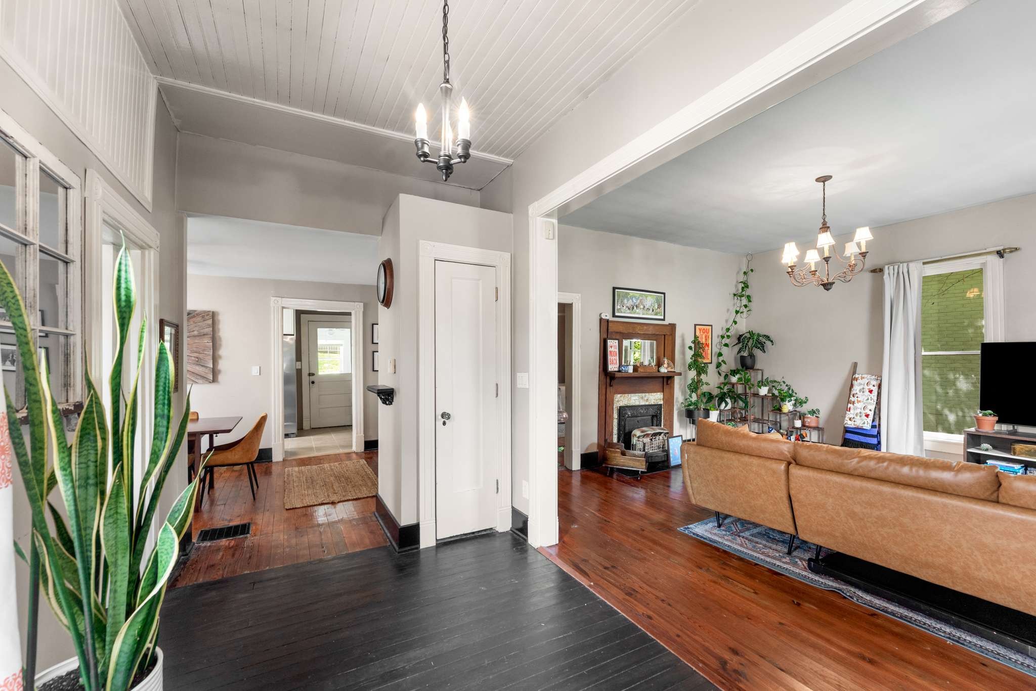 3905 Nevada Avenue Nashville, TN 37209 - Photo 5 of 39 a living room with furniture a chandelier and a bookshelf
