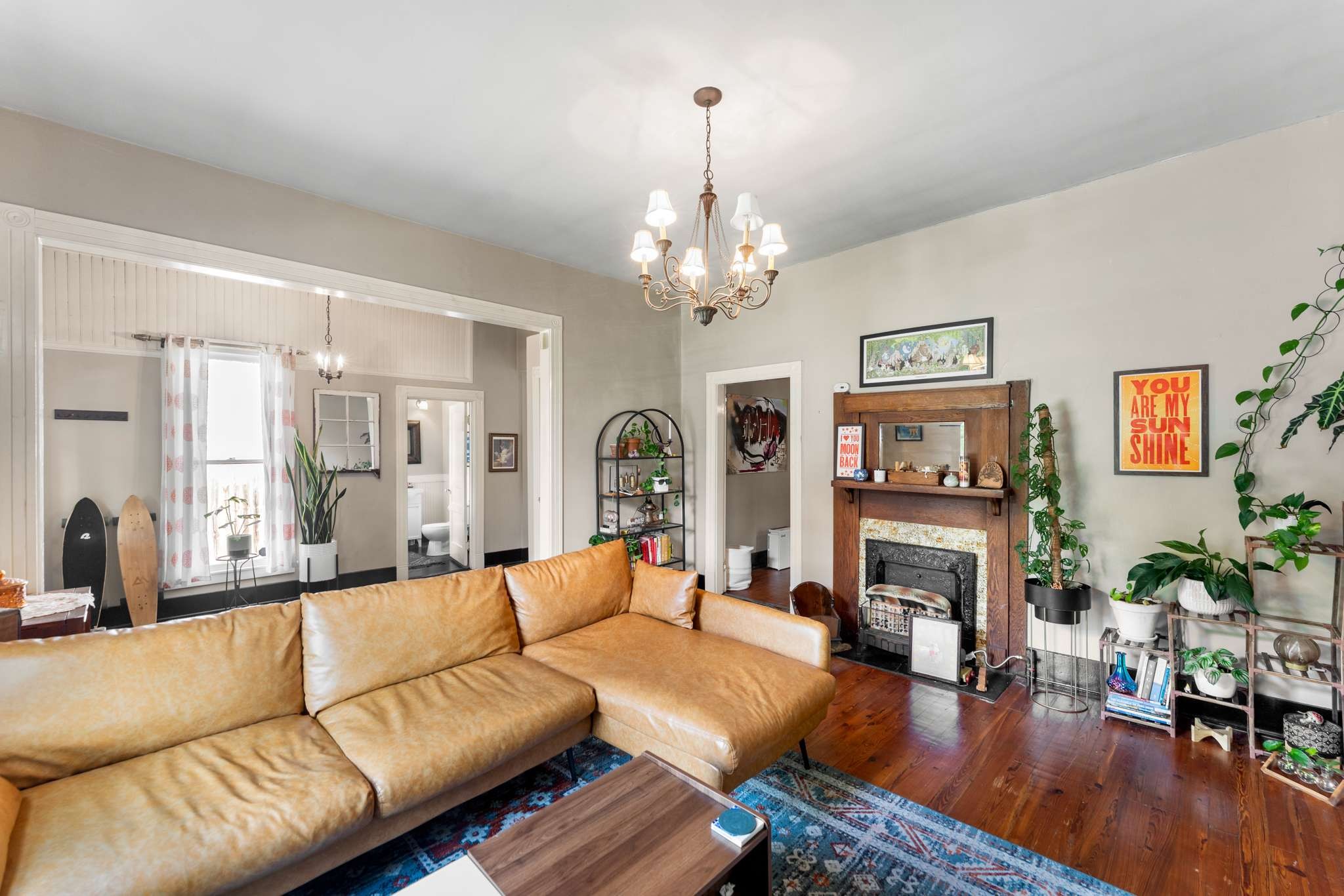3905 Nevada Avenue Nashville, TN 37209 - Photo 6 of 39 a living room with furniture a fireplace and a chandelier