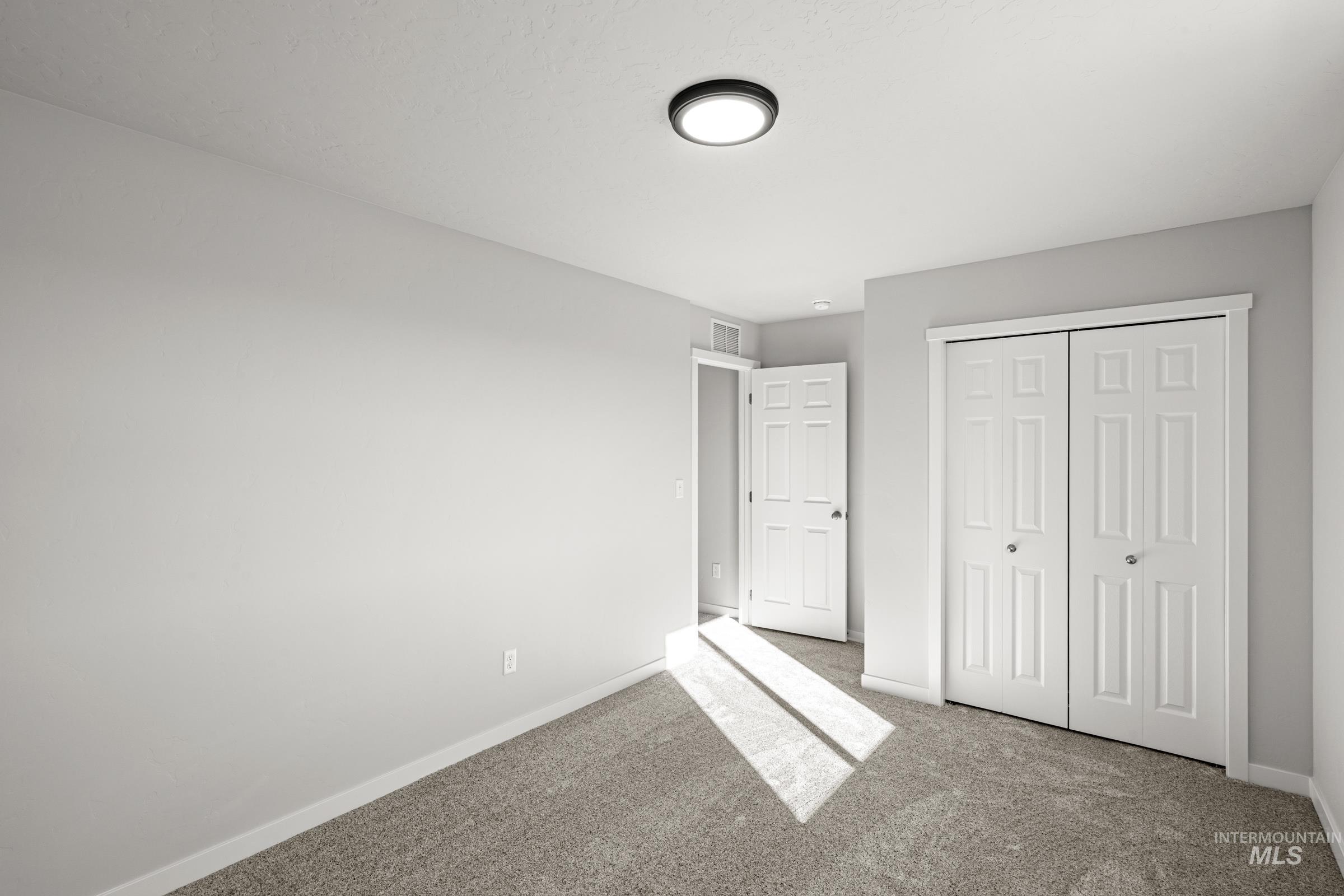 1647 Dyer Street Middleton, ID 83644 - Photo 15 of 25 Unfurnished bedroom with a closet and carpet floors