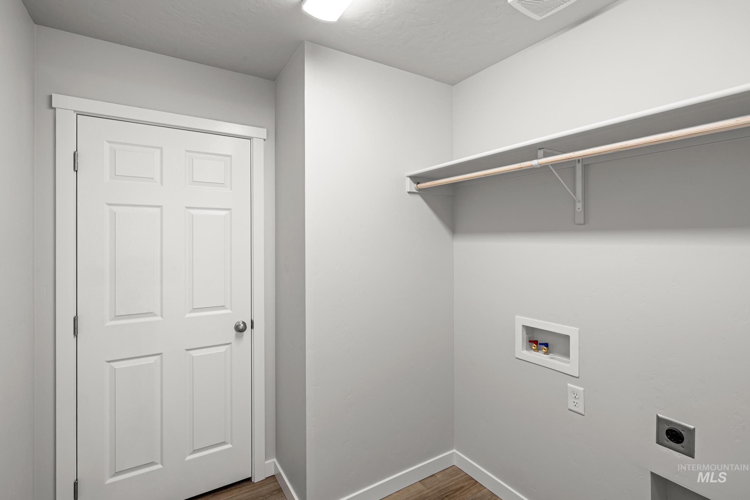 1647 Dyer Street Middleton, ID 83644 - Photo 18 of 25 Laundry area with dark wood-style floors, hookup for an electric dryer, and hookup for a washing machine