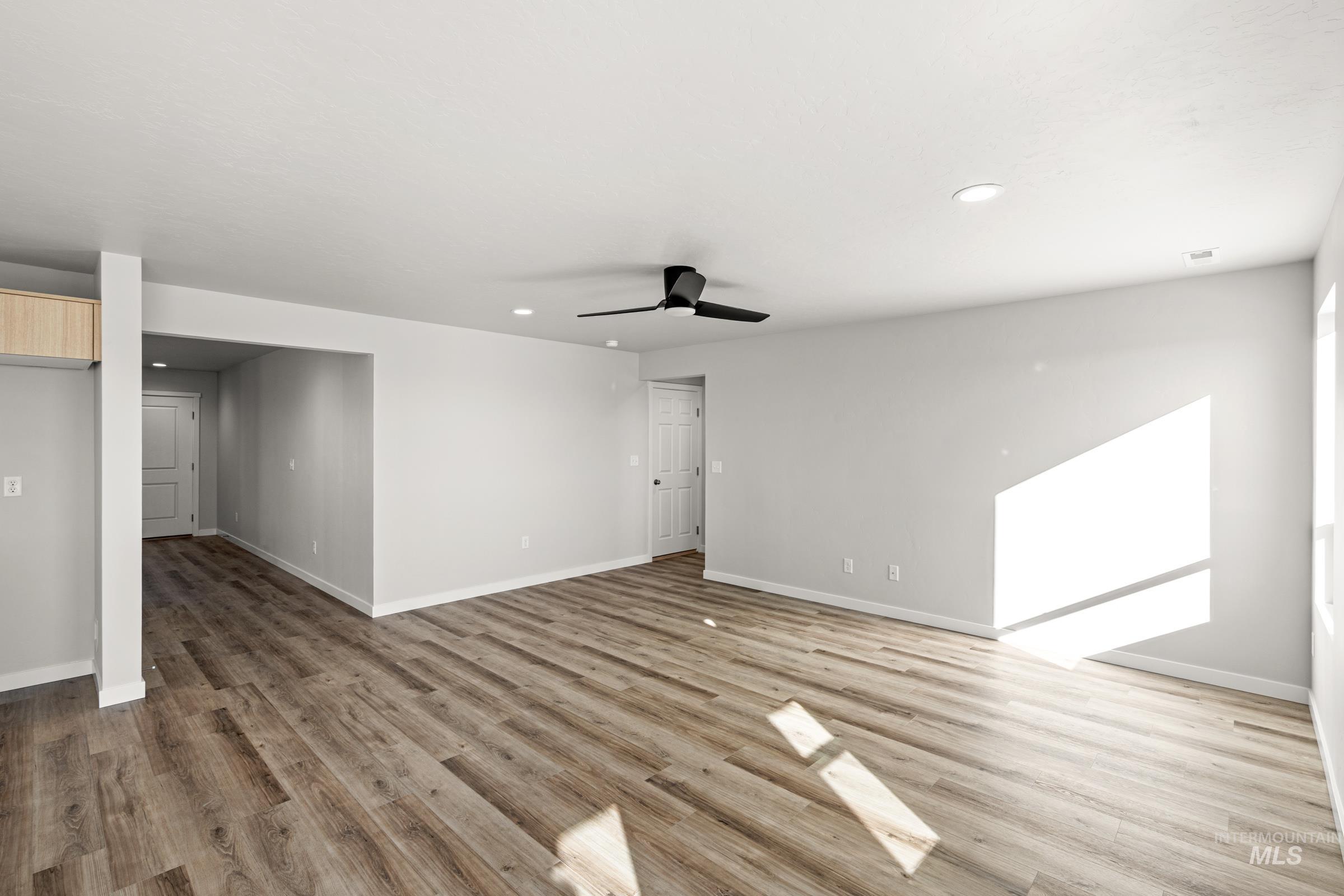 1647 Dyer Street Middleton, ID 83644 - Photo 10 of 25 Spare room featuring a ceiling fan, light wood-style floors, and recessed lighting