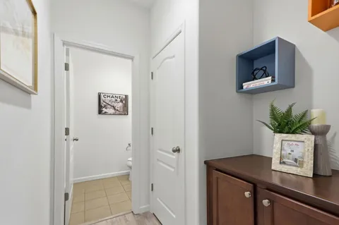 a view of bathroom with a potted plant on the wall