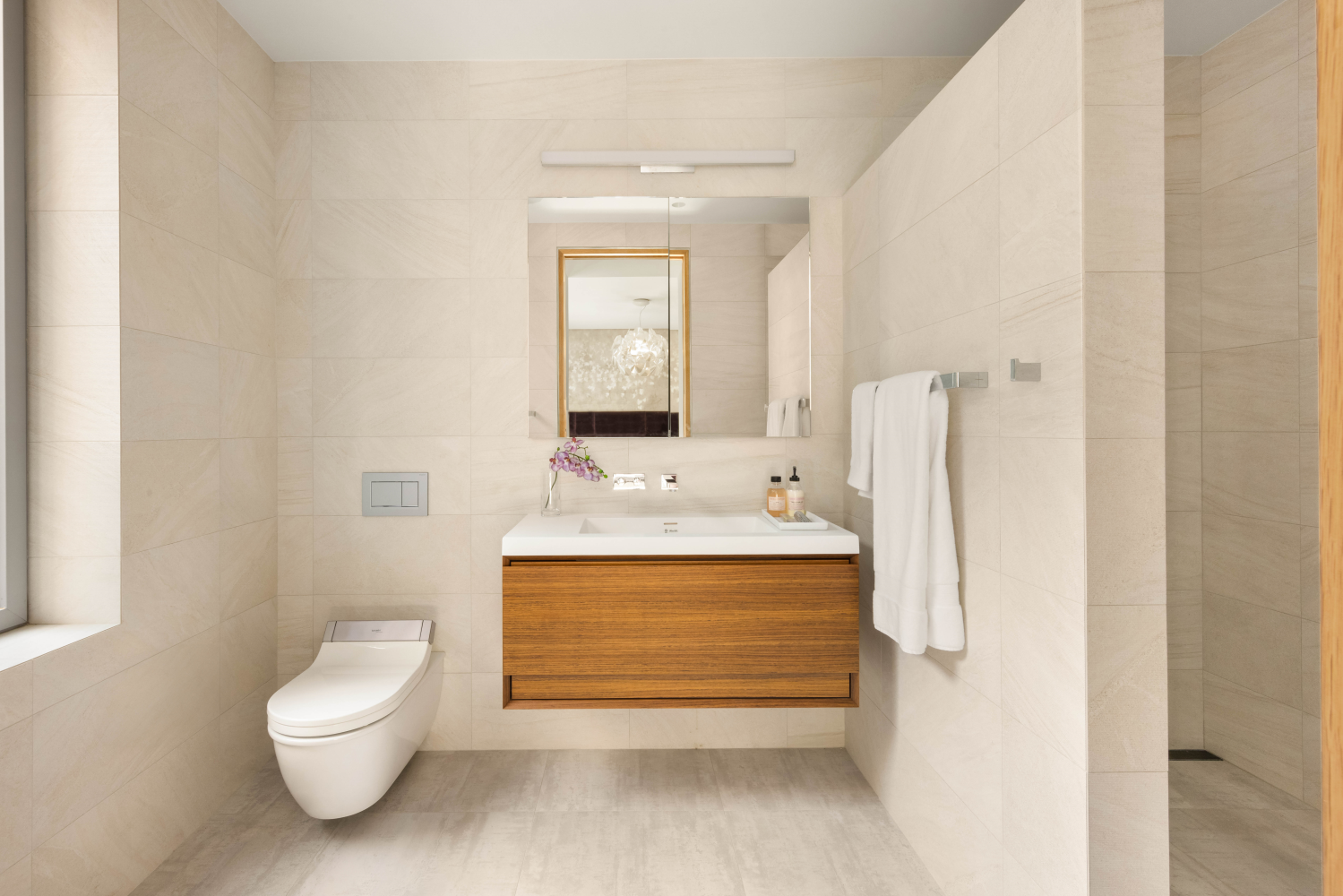 9 Minetta Street Manhattan, NY 10012 - Photo 13 of 18 a bathroom with a granite countertop sink toilet a mirror and bathtub